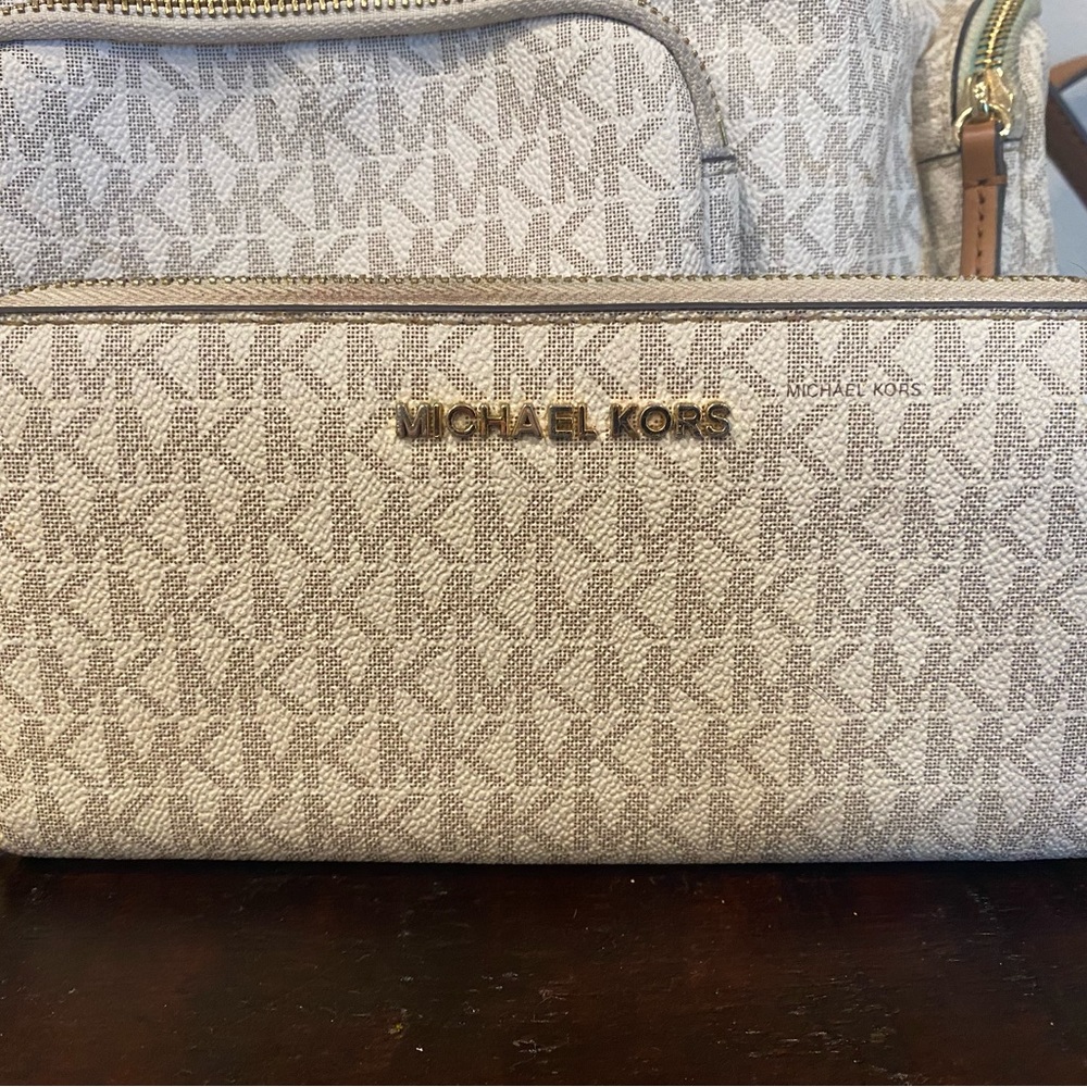 Michael Kors wallet and backpack.